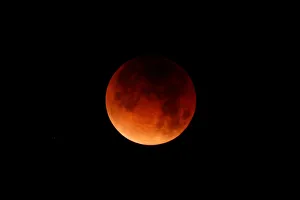 Lunar Prints: A lunar eclipse is shown over the ocean in Oceanside, California