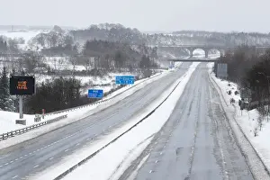 Weather Prints: The M80 motorway is completely empty after being closed to clear vehicles stranded by bad