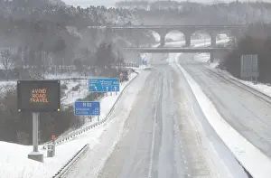 Britain Prints: The M80 motorway is completely empty after being closed to clear vehicles stranded by bad