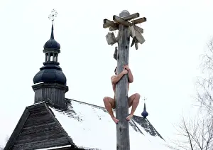 Belarus Prints: Man climbs up a wooden pole to get a prize during celebration of Maslenitsa