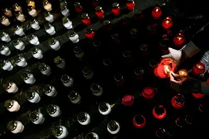 A man lights a candle outside General Wojciech Jaruzelskis house in Warsaw