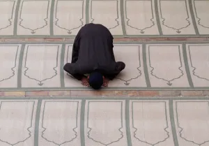 A man offers evening prayer at a mosque in Peshawar