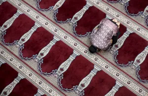 Indonesia Prints: A man prays following Friday prayers at the Cut Meutia Mosque in Jakarta