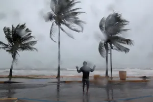 Storm Prints: A man reacts in the winds and rain in Luquillo as Hurricane Irma slammed across islands