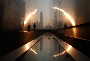 USA Prints: A man walks through the 9 / 11 Empty Sky memorial across from New Yorks Lower Manhattan