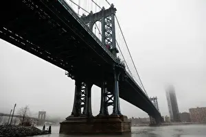 Weather Prints: The Manhattan skyline is seen partially in fog from beneath the Manhattan bridge in