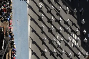 Shadow Prints: A marching band makes their way through Times Square during the 85th Macys Thanksgiving