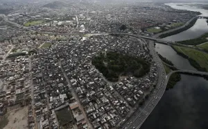 Prints of The Mare slums complex, with the Linha Vermelha Freway on the right, is pictured from above ahead of its occupation by federal troops this Sunday in Rio de Janeiro March 28, 2014 Brazil Prints: The Mare slums complex, with the Linha Vermelha Freway on the right