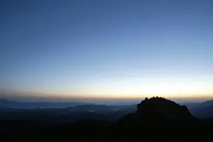 Members of an international religious movement called the White Brotherhood wait for the sunrise