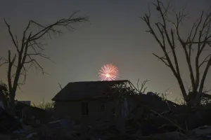 Tornado Prints: Memorial Day fireworks explode over a house damaged by the May 20 afternoon tornado in