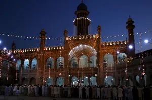 Religion Prints: Men attend evening prayers during the last week of the Muslim fasting month of Ramadan