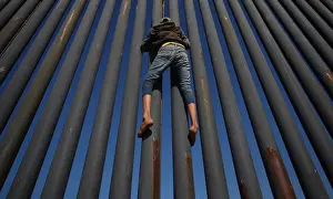 A migrant, part of a caravan of thousands from Central America trying to reach the United