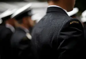 : A military serviceman marches in the rain during an Anzac Day parade in Sydney