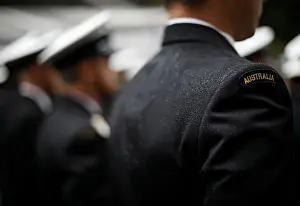 : A military serviceman marches in the rain during an Anzac Day parade in Sydney