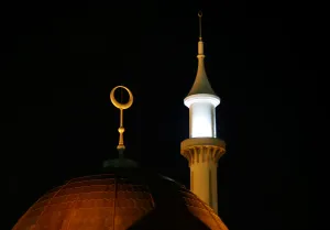 A minaret and a crescent moon on the Abuja central mosque are illuminated as Nigerian A minaret and a crescent moon on the Abuja central mosque are illuminated as Nigerian