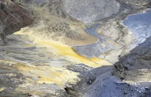 Two miners walk through a open copper pit in the Serbian town of Bor Two miners walk through a open copper pit in the Serbian town of Bor