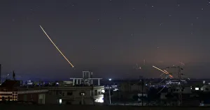 Mideast Prints: Missile fire is seen over Daraa