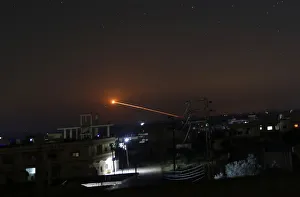 Syria Prints: Missile fire is seen over Daraa