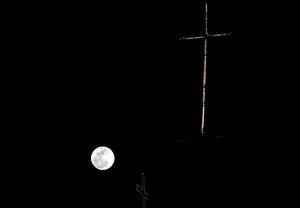 Lunar Prints: The moon rises over the Mount of Olives during a rare overlap of three celestial