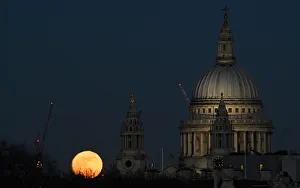 Lunar Prints: A full moon rises behind St Pauls Cathedral London