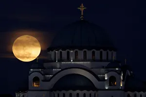 Lunar Prints: A full moon rises behind St. Sava temple in Belgrade