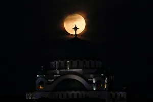 Lunar Prints: A full moon rises behind St. Sava temple in Belgrade
