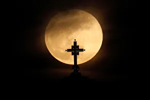 Lunar Prints: A full moon rises behind St. Sava temple in Belgrade