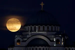 Lunar Prints: A full moon rises behind St. Sava temple in Belgrade