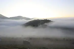 Morning mist covers the Israeli-Syrian border near Majdal Shams in the Golan Heights