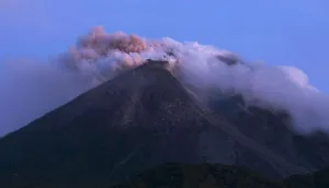 Indonesia Prints: Mount Merapi emits smoke as it is seen from Kali Tengah village near Yogyakarta