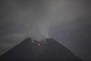 Indonesia Prints: Mount Merapi volcano spews smoke as seen from Balerante village in Klaten