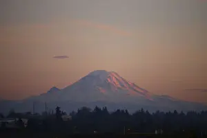 Mount Rainier is pictured as the last rays of sunlight hit its western side, taken