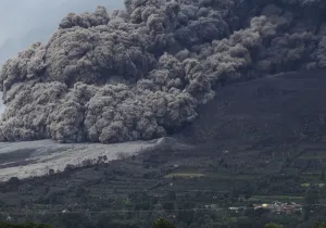 Indonesia Prints: Mount Sinabung volcano spews ash during an eruption, as seen from Berastepu village in