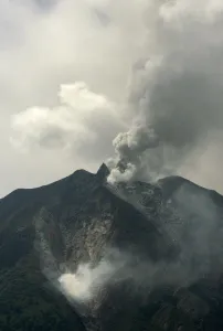 The Mount Sinabung volcano spews smoke in the district of Tanah Karo outside the city of The Mount Sinabung volcano spews smoke in the district of Tanah Karo outside the city of