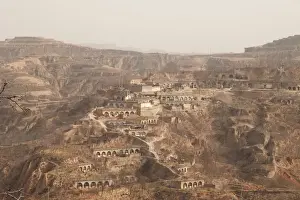 Prints of A mountain village with subterranean houses, that locals refer to as caves, is pictured in Lin county, Shanxi province, China March 15, 2018. Picture taken March 15, 2018. REUTERS/Joseph Campbell China Prints: A mountain village with subterranean houses is pictured in Lin county