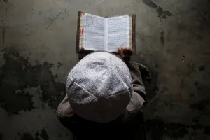 Religion Prints: A Muslim boy learns to read the Koran at a madrassa, or religious school, during