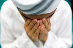 Muslim boy performs prayers on the first Friday of the holy fasting month of Ramadan Muslim boy performs prayers on the first Friday of the holy fasting month of Ramadan
