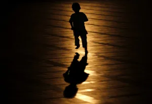 A muslim child runs after a mass prayer session marking the beginning of Ramadan at A muslim child runs after a mass prayer session marking the beginning of Ramadan at