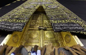 Muslims touch the holy Kaaba at the Grand Mosque during the holy fasting month of Ramadan Muslims touch the holy Kaaba at the Grand Mosque during the holy fasting month of Ramadan