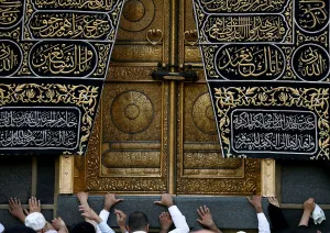 Religion Prints: Muslims touch the Kaaba at the Grand Mosque during the holy fasting month of Ramadan in