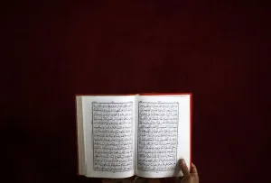 Nepal Prints: A Nepalese Muslim reads the Koran during the month-long fasting in the holy month of
