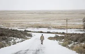 Oregon Prints: An occupier walks along a road at the Malheur National Wildlife Refuge near Burns, Oregon