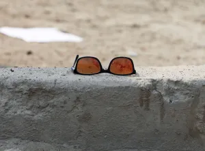 A pair of sunglass with blood is seen at the site of a suicide bomb attack near a Shi' A pair of sunglass with blood is seen at the site of a suicide bomb attack near a Shi'