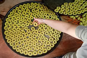 Eid Prints: Palestinian man prepares traditional cakes for sale ahead of Muslim holiday of Eid