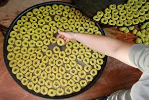 Palestinian man prepares traditional cakes for sale ahead of Muslim holiday of Eid al-Fitr
