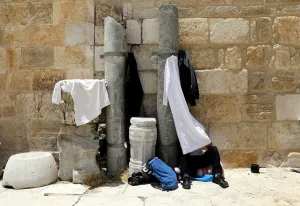 Prints of A Palestinian man reads the Koran in the compound known to Muslims as Noble Sanctuary and to Jews as Temple Mount in Jerusalems Old City, on the last Friday of the holy month of Ramadan May 31, 2019 Israel Prints: A Palestinian man reads the Koran in the compound known to Muslims as Noble Sanctuary