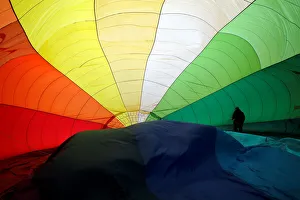 A Participant prepares a balloon for inflation during the International Hot Air Balloon A Participant prepares a balloon for inflation during the International Hot Air Balloon
