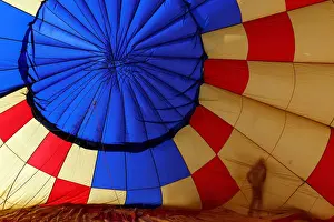 Swiss Prints: A Participant prepares a balloon for inflation during the International Hot Air Balloon