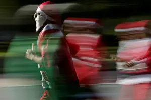 Participants dressed as Santa Claus take part in the annual race known as Run Santa Run