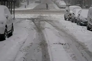 Weather Prints: Pedestrian crosses 41st St. during Storm Grayson in New York City